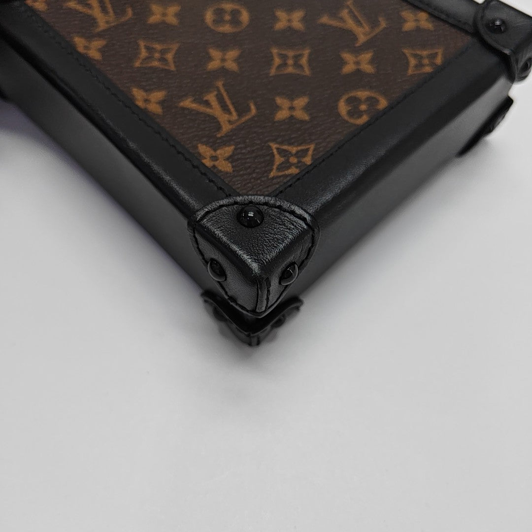 TRUNK Monogram Coated Canvas Brown
