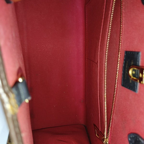 ONTHEGO MM Monogram Coated Canvas Brown