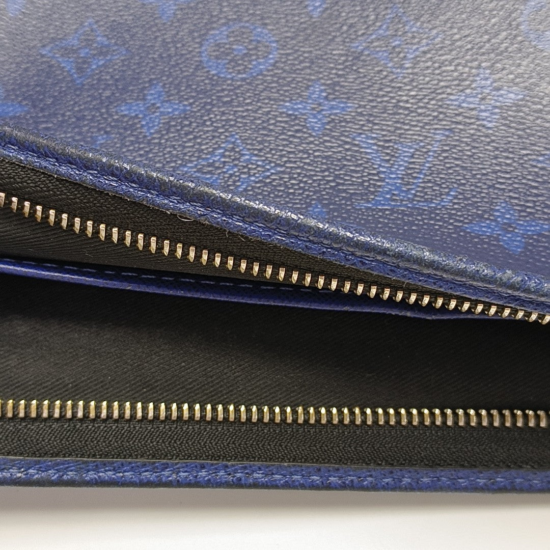 Pochette Voyag MM Monogram Coated Canvas Blue