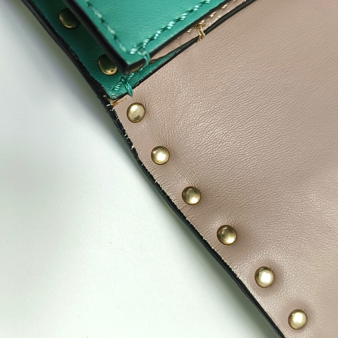 Authenticated pre-owned  Rockstud Lambskin Green - Clutch at Looply