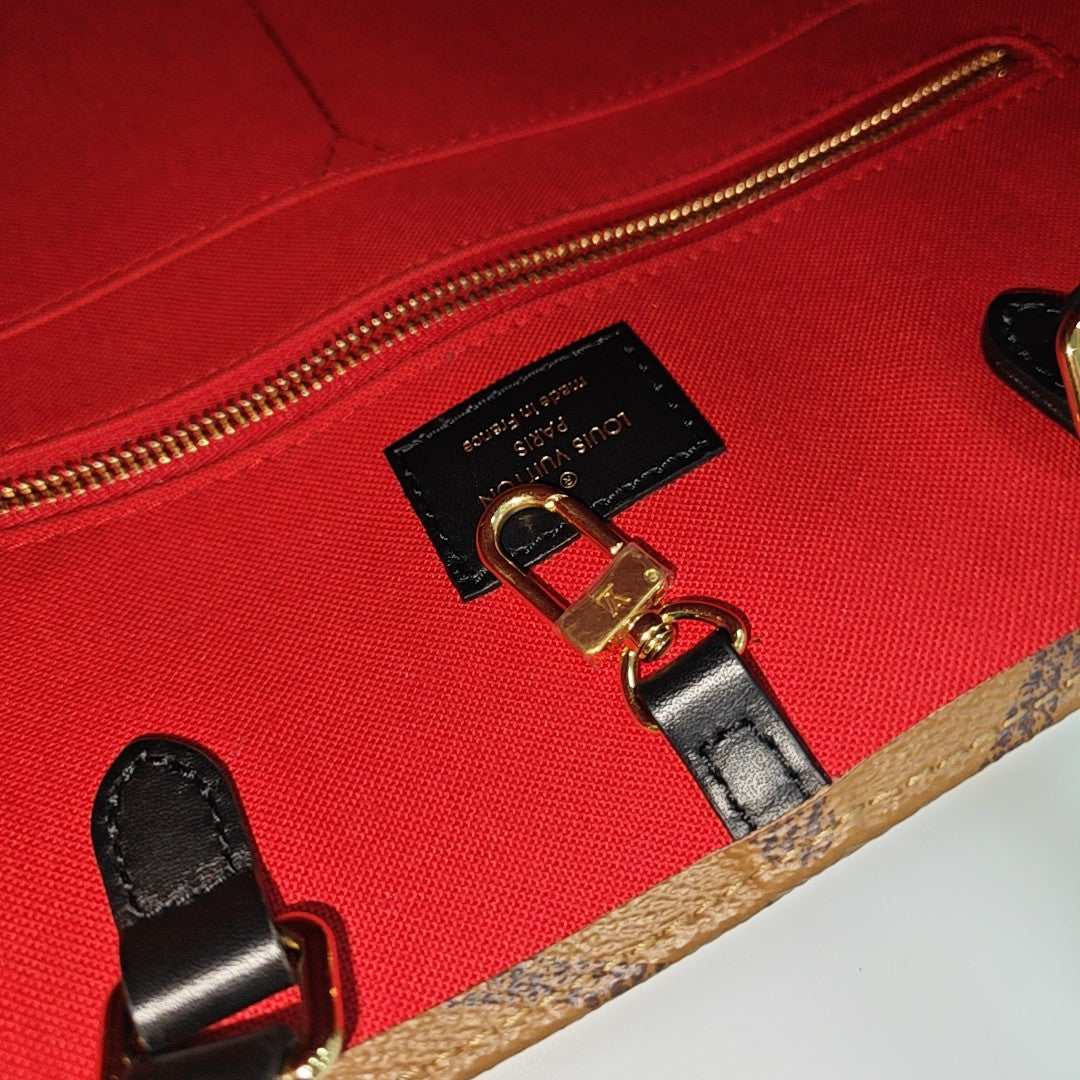 ONTHEGO MM Monogram Coated Canvas Brown