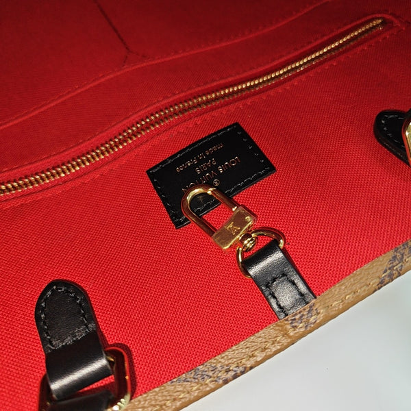 ONTHEGO MM Monogram Coated Canvas Brown
