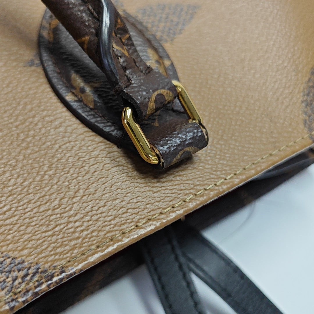 ONTHEGO MM Monogram Coated Canvas Brown