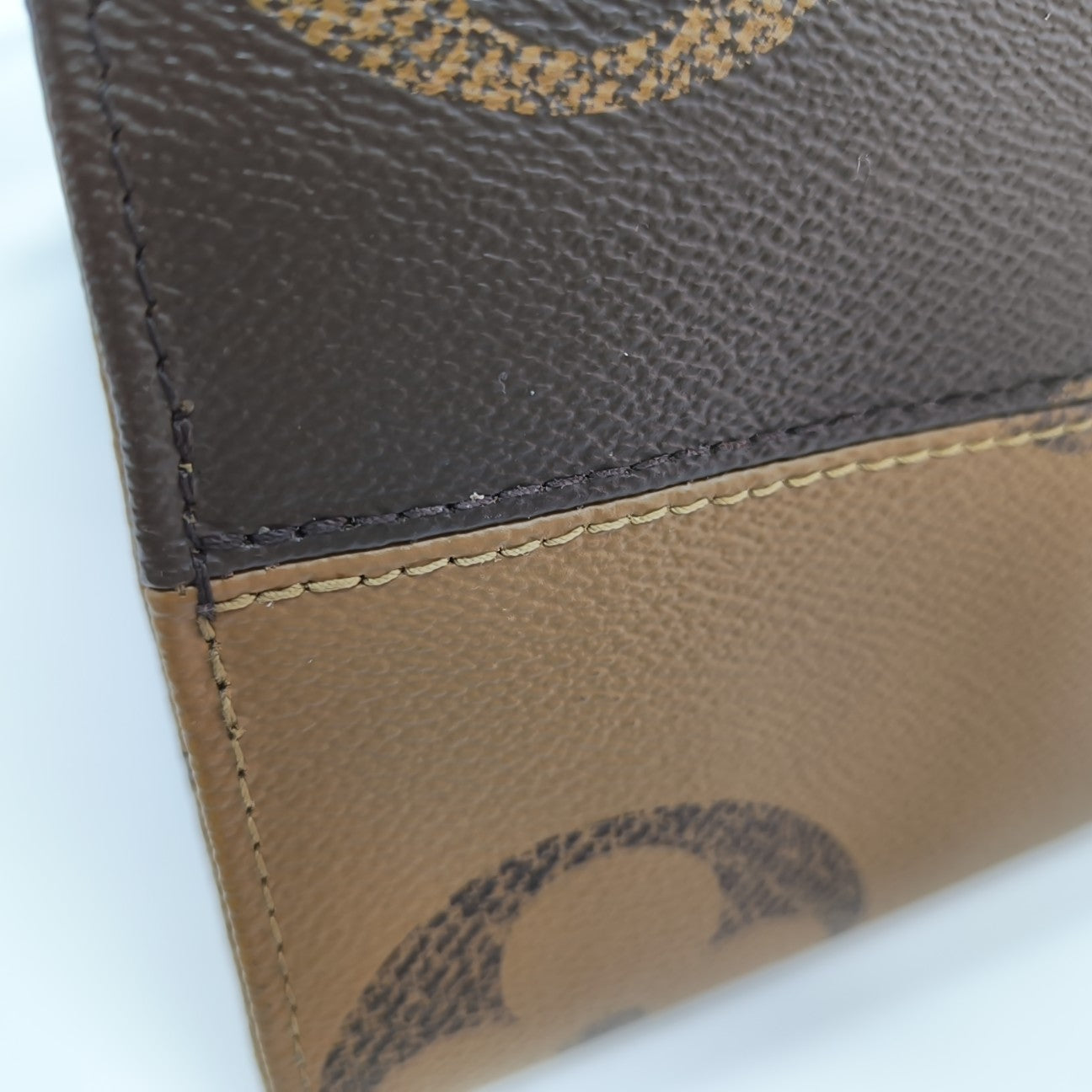 ONTHEGO MM Monogram Coated Canvas Brown