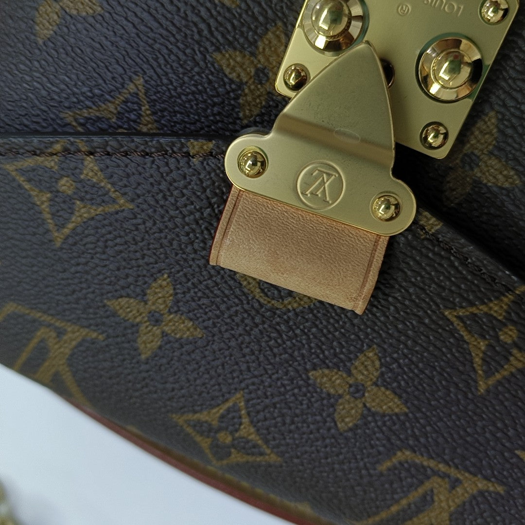 MÉTIS EAST WEST Monogram Coated Canvas Brown