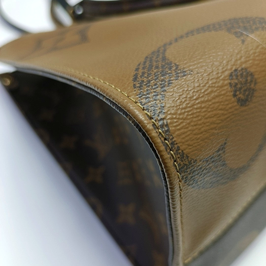 ONTHEGO MM Monogram Coated Canvas Brown
