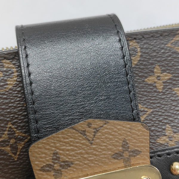 TRUNK Monogram Coated Canvas Brown