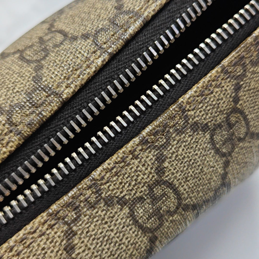 Monogram Coated Canvas Clutch Brown