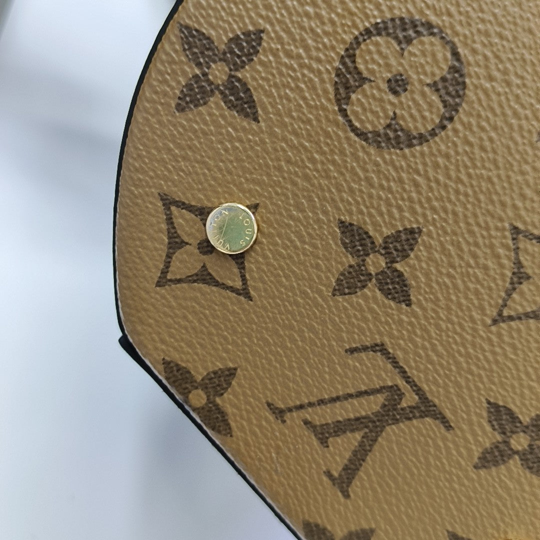 CANNES PM Monogram Coated Canvas Brown