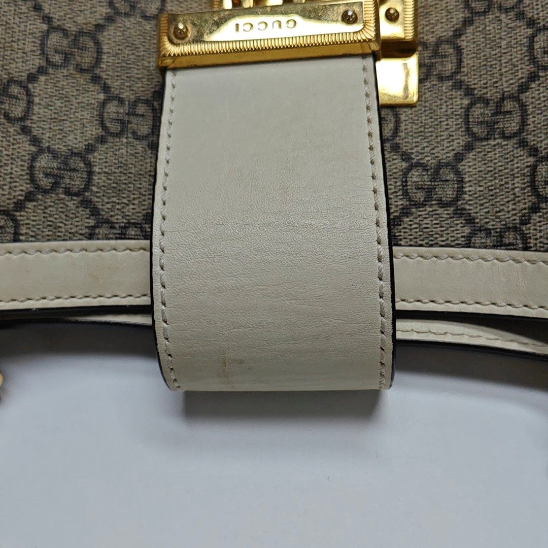 Authenticated pre-owned  Padlock Medium Monogram Coated Canvas Beige - Shoulder Bag at Looply
