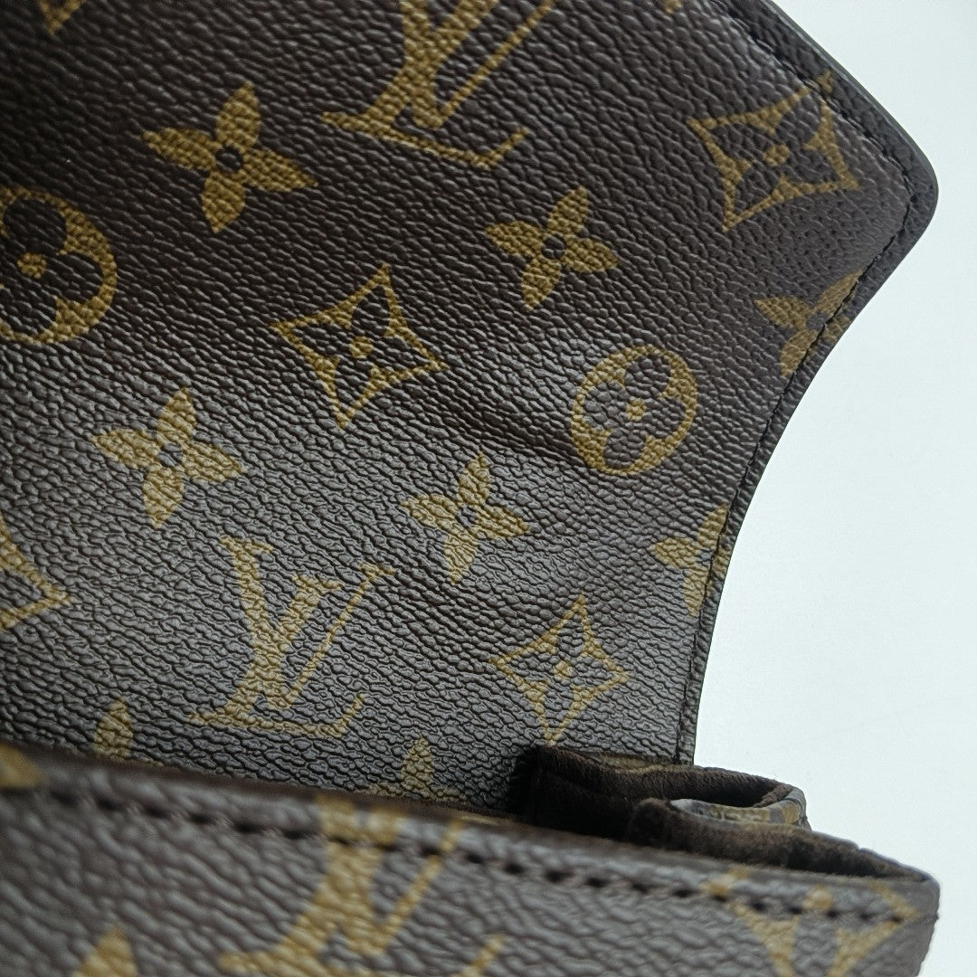 MÉTIS EAST WEST Monogram Coated Canvas Brown