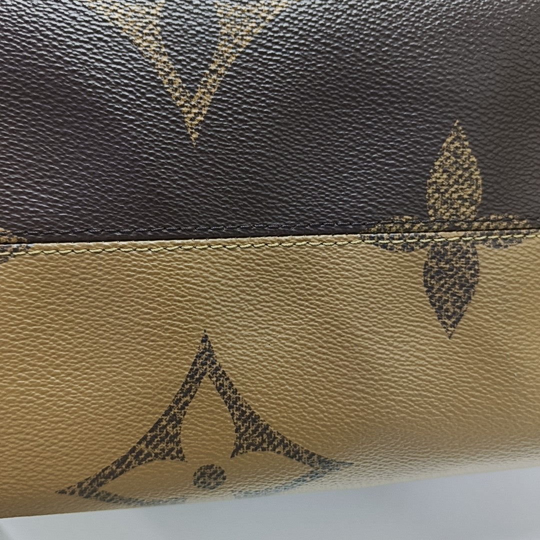 ONTHEGO MM Monogram Coated Canvas Brown