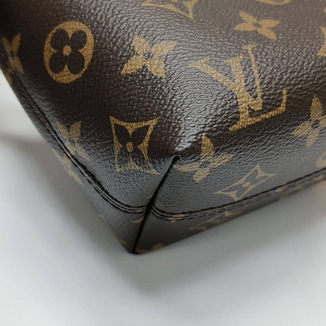 Pochette Mia Monogram Coated Canvas Brown