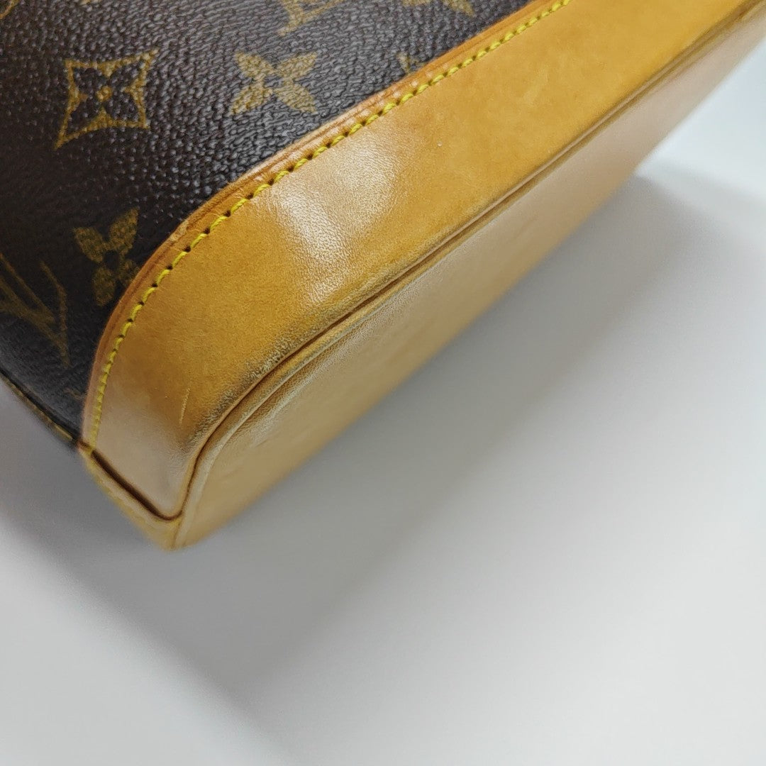 ALMA PM Monogram Coated Canvas Brown