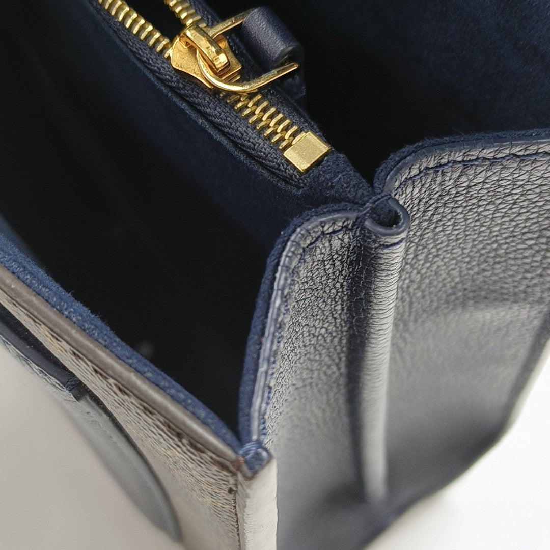 VICTOIRE Monogram Coated Canvas Brown