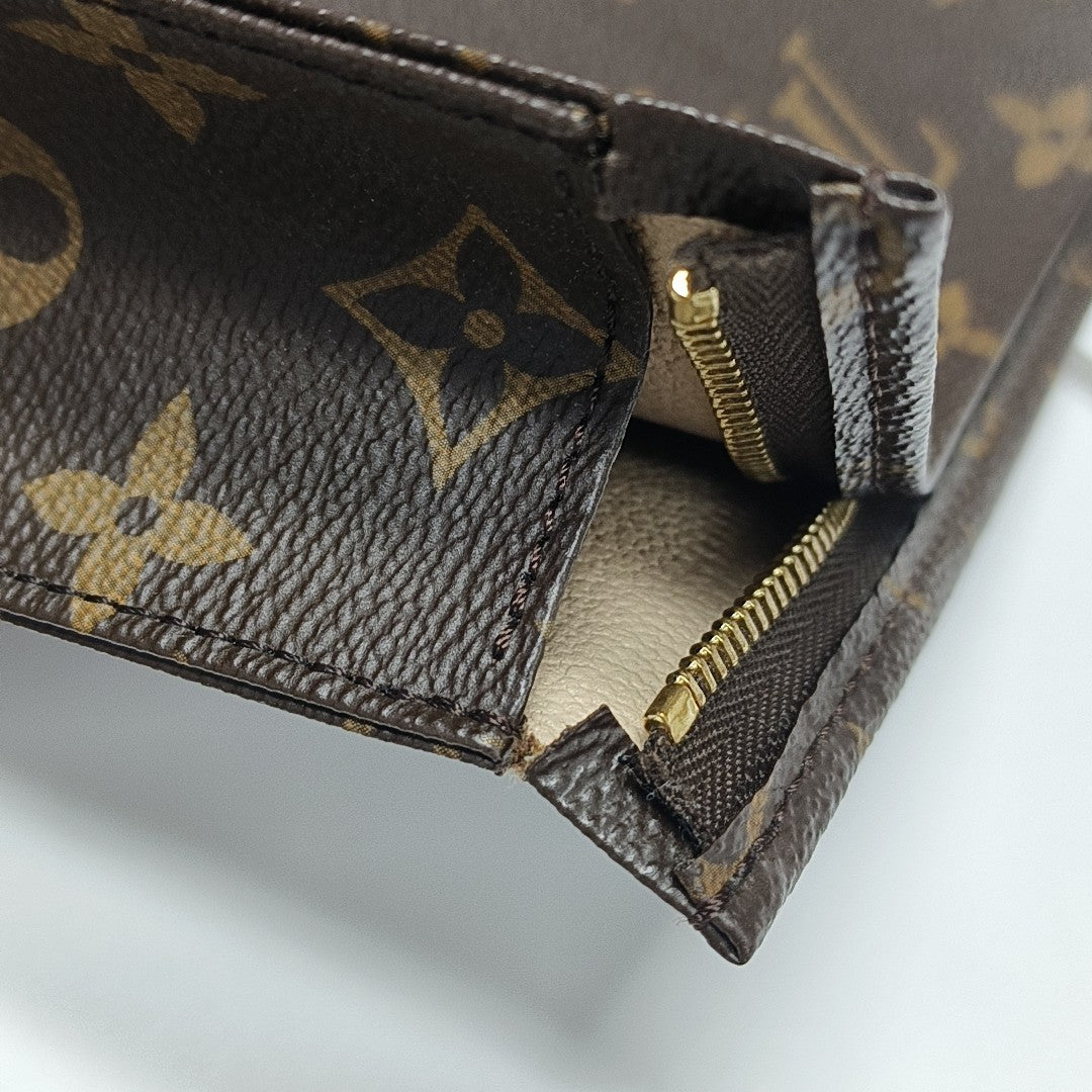 TOILET POCKET 26 Monogram Coated Canvas Brown
