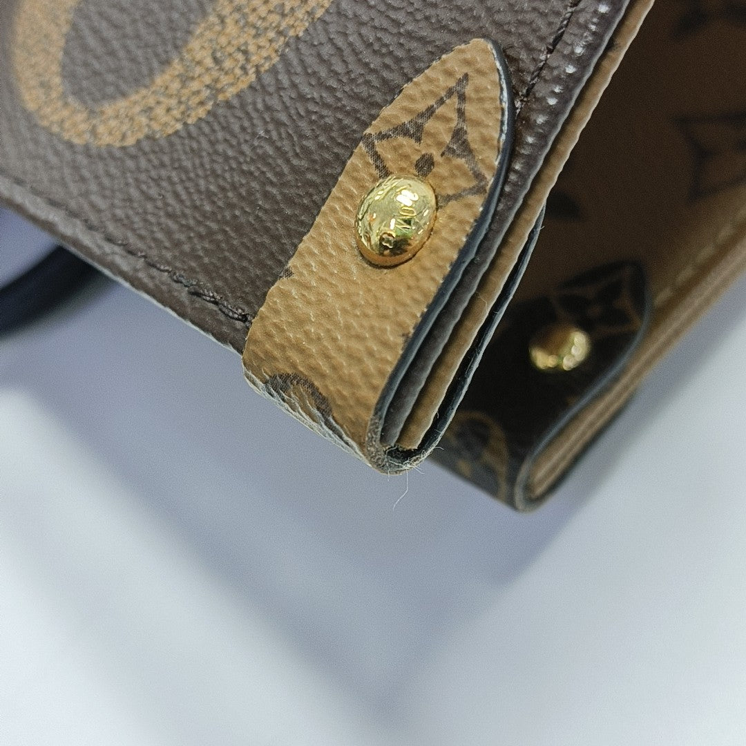ONTHEGO GM Monogram Coated Canvas Brown