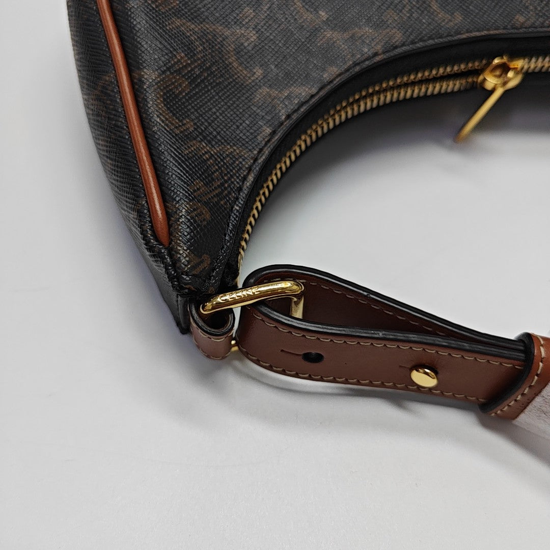 Authenticated pre-owned  AVA Coated Canvas Brown - Top Handle Bag at Looply