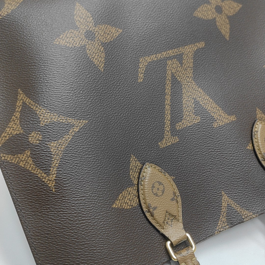 ONTHEGO MM Monogram Coated Canvas Brown