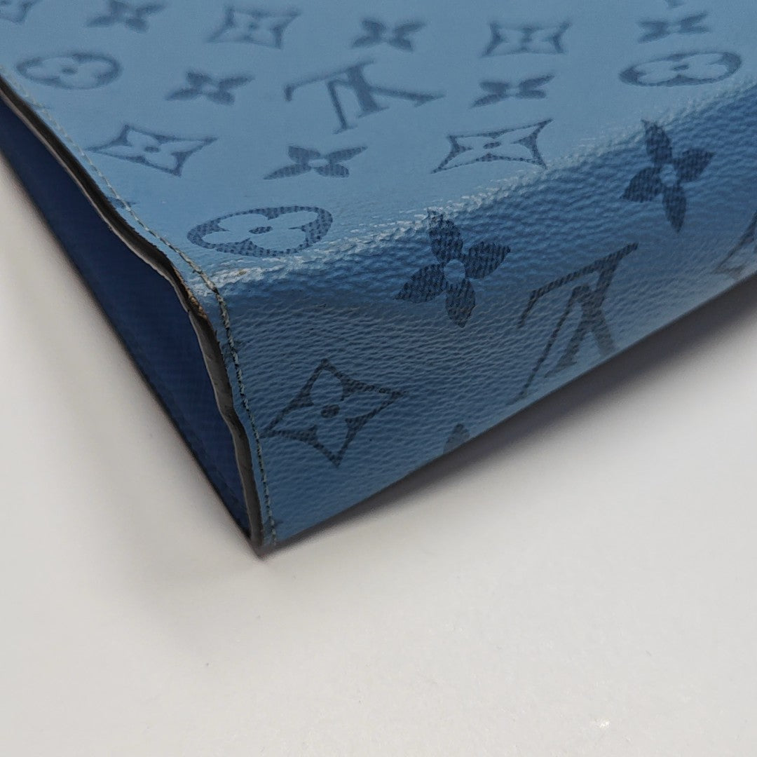 Pochette Voyag MM Monogram Coated Canvas Blue
