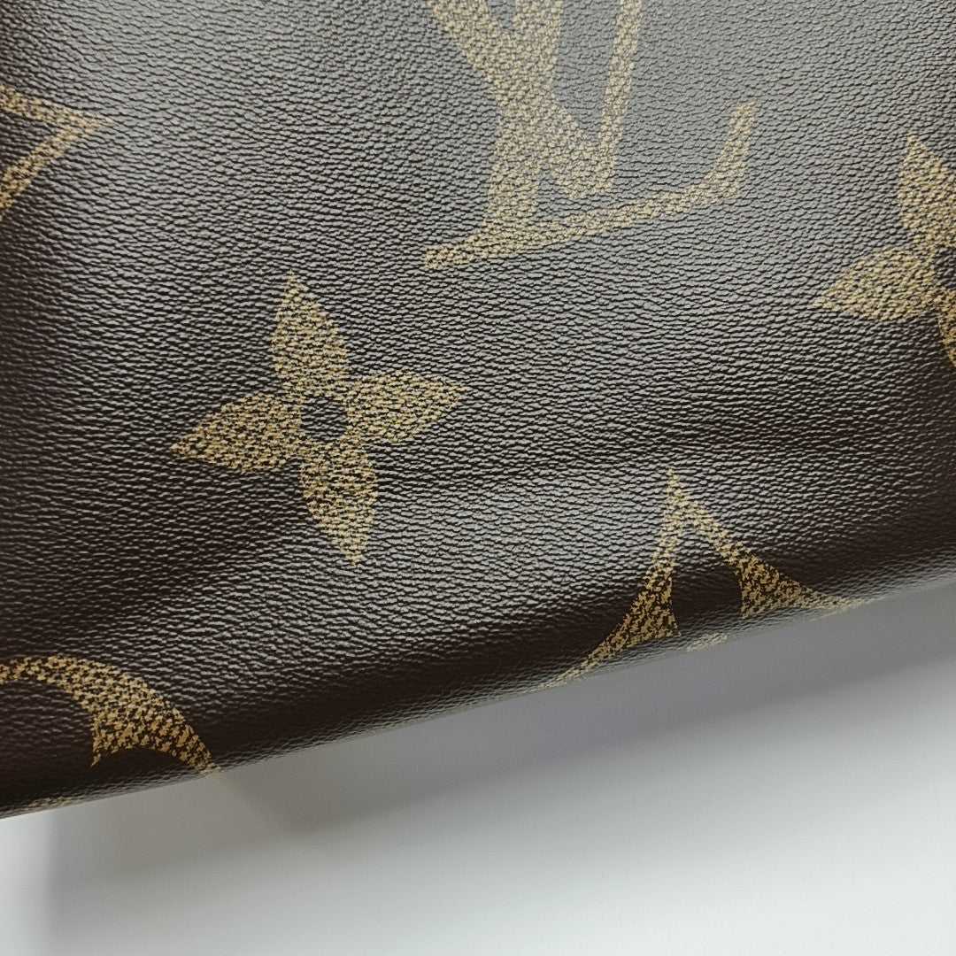 ONTHEGO MM Monogram Coated Canvas Brown