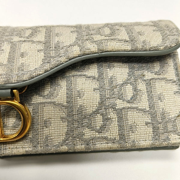 Authenticated pre-owned  Saddle Oblique Fabric Gray Card Holder - Card Holder at Looply