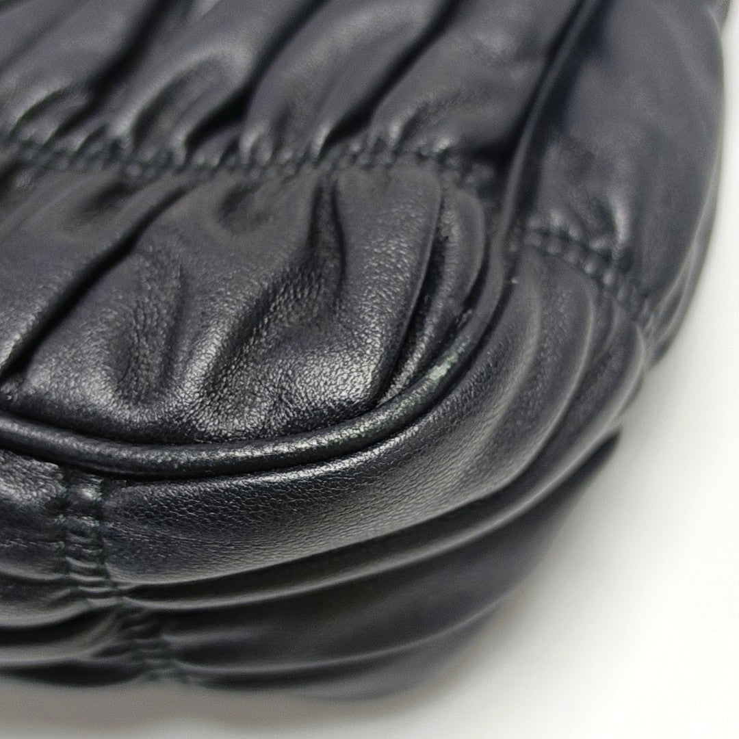 Authenticated pre-owned  Re-Edition2005 Quilted Lambskin Black - Top Handle Bag at Looply