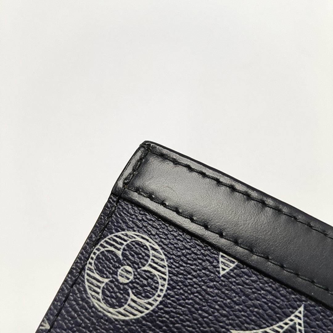 Pochette Voyag MM Monogram Coated Canvas Blue
