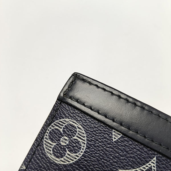 Pochette Voyag MM Monogram Coated Canvas Blue