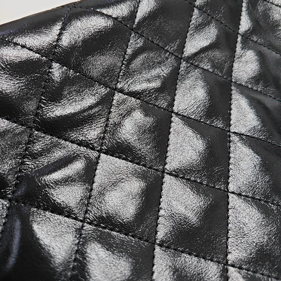 CHANEL 25 Small Quilted Waxed Cafskin Black