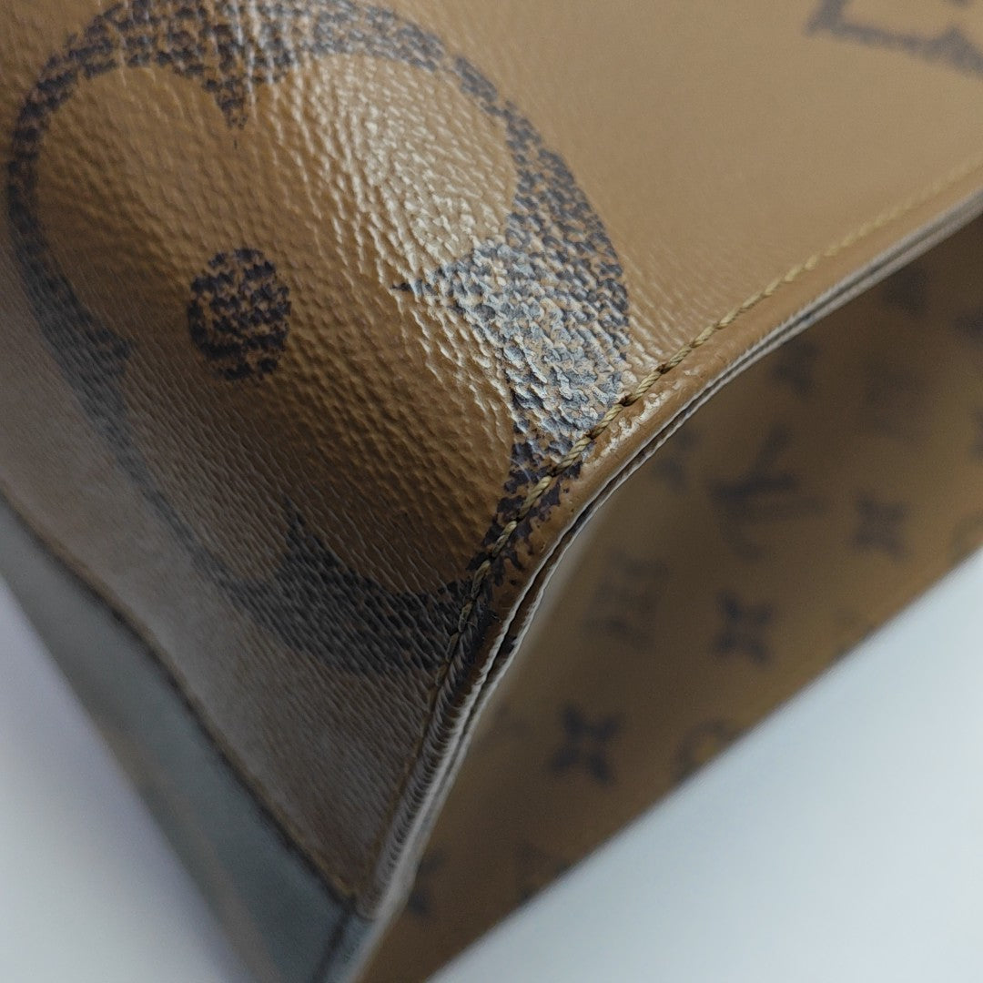ONTHEGO MM Monogram Coated Canvas Brown