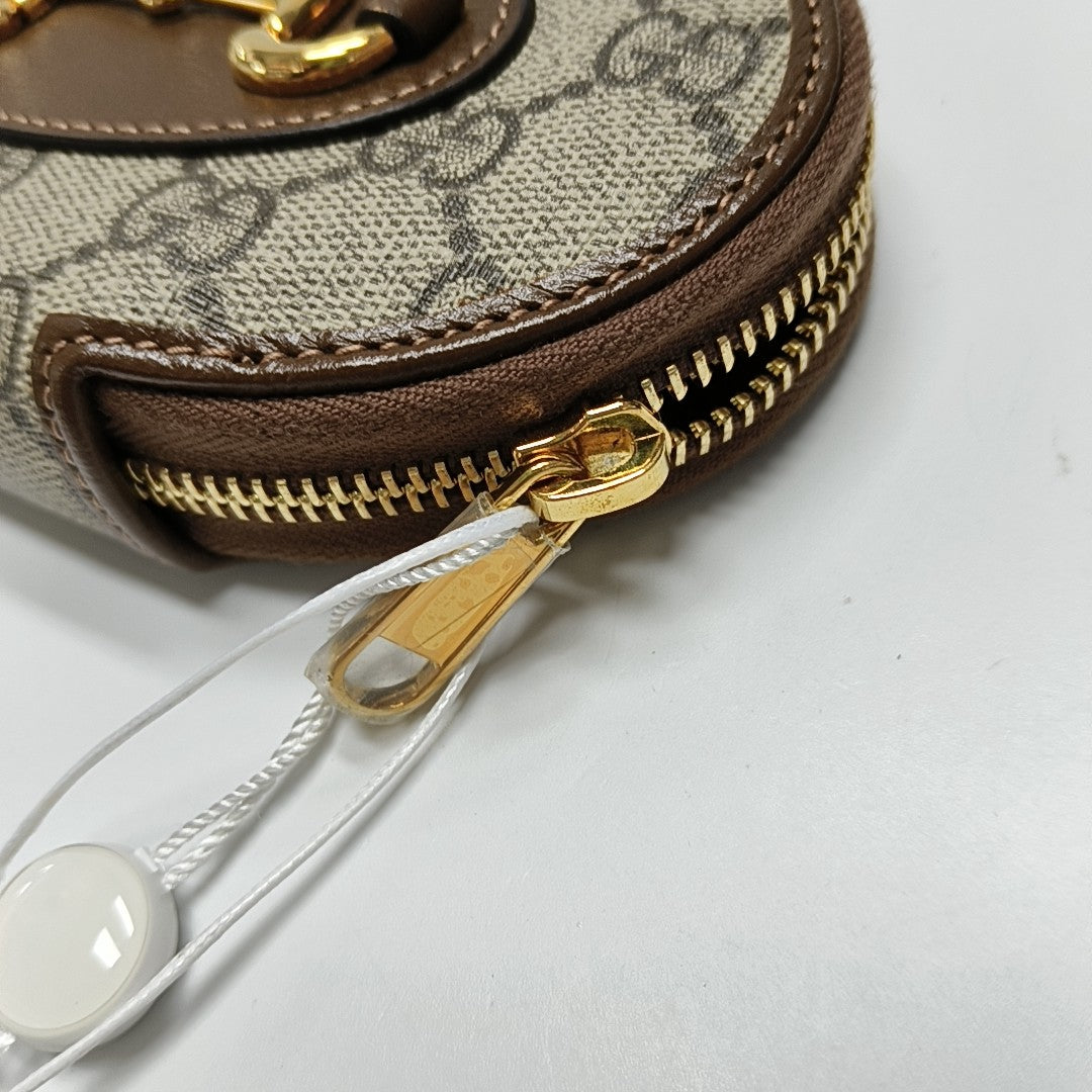 Authenticated pre-owned  Horsebit 1955 Monogram Coated Canvas Beige Coin Purse - Coin Purse at Looply