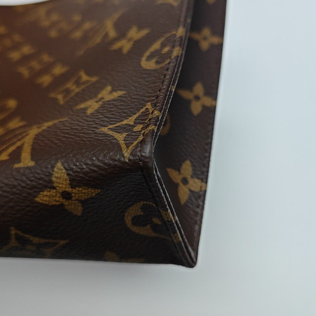 TOILET POCKET 26 Monogram Coated Canvas Brown