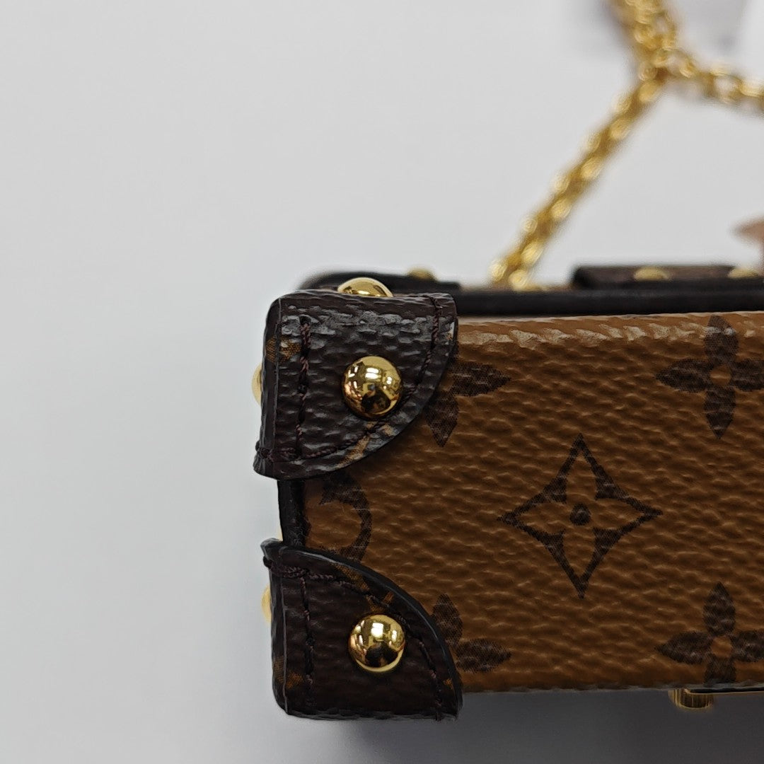 TRUNK Monogram Coated Canvas Brown