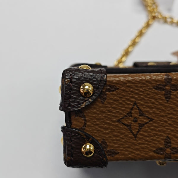 TRUNK Monogram Coated Canvas Brown