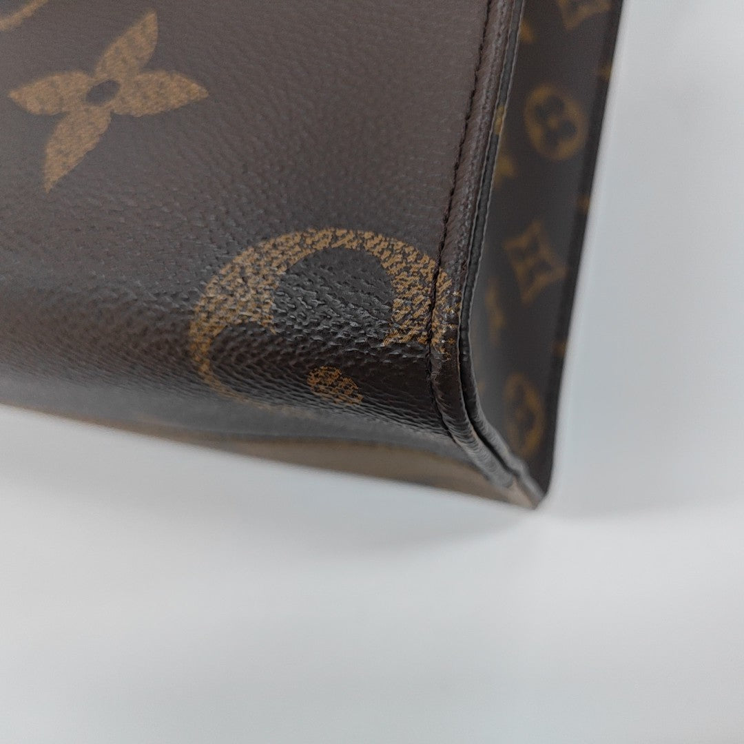 ONTHEGO PM Monogram Coated Canvas Brown