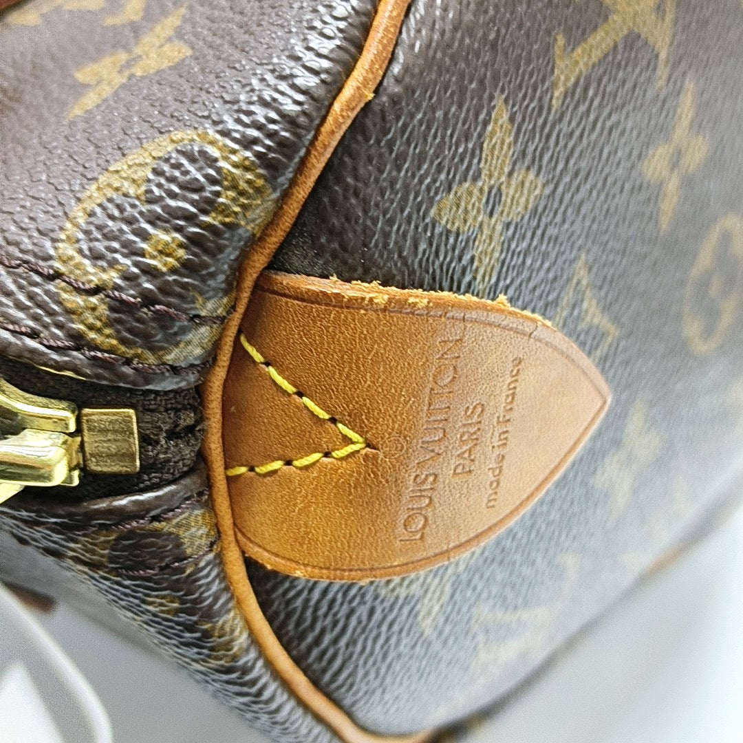 Authenticated pre-owned  SPEEDY 25 Monogram Coated Canvas Brown - Top Handle Bag at Looply