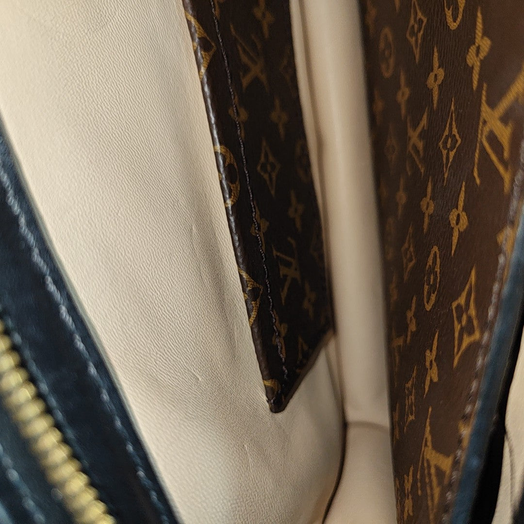 TRUNK Monogram Coated Canvas Brown