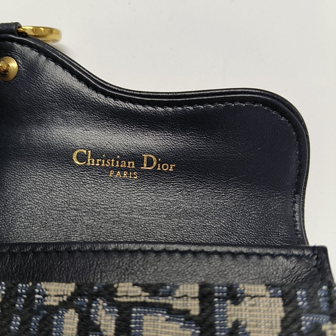 Authenticated pre-owned  Saddle Monogram Canvas Blue Card Holder - Card Holder at Looply