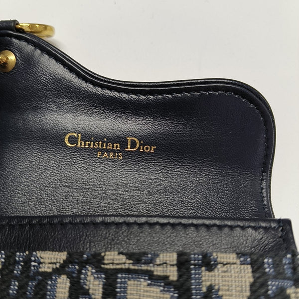 Authenticated pre-owned  Saddle Monogram Canvas Blue Card Holder - Card Holder at Looply