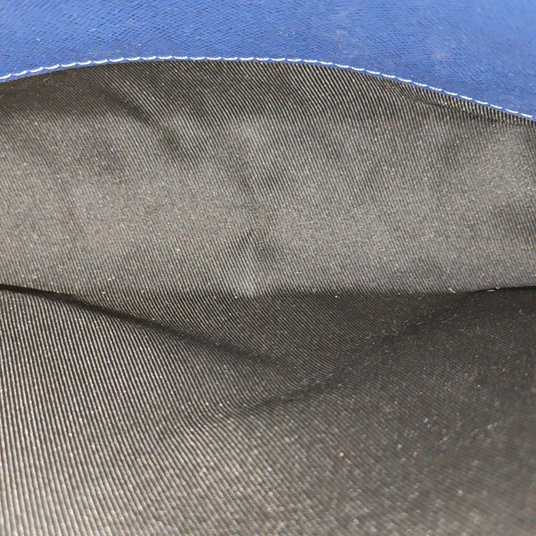 Pochette Voyag MM Monogram Coated Canvas Blue