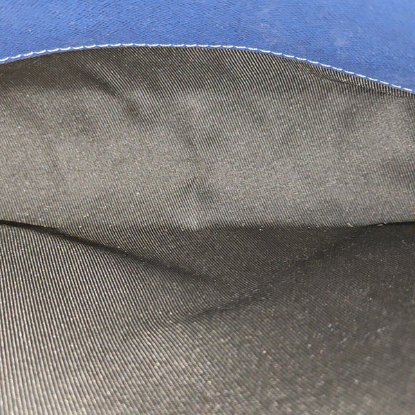Pochette Voyag MM Monogram Coated Canvas Blue