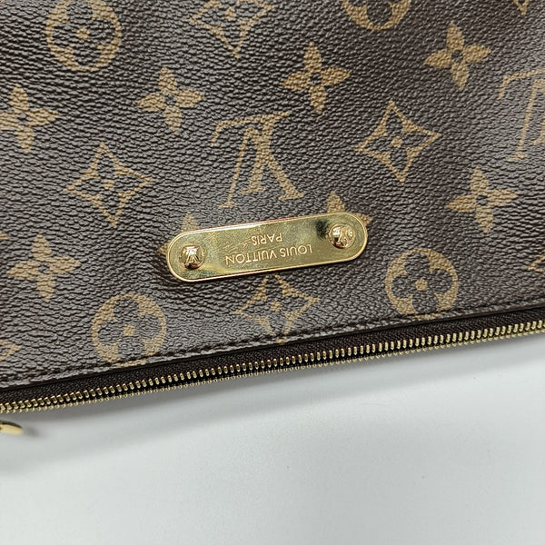 Pochette Eva Monogram Coated Canvas Brown