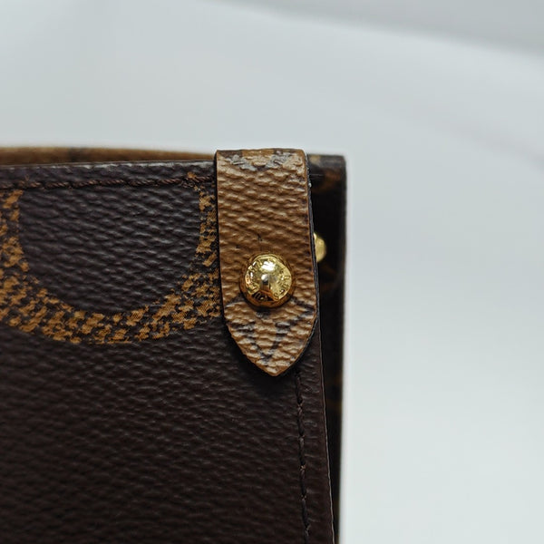 ONTHEGO MM Monogram Coated Canvas Brown