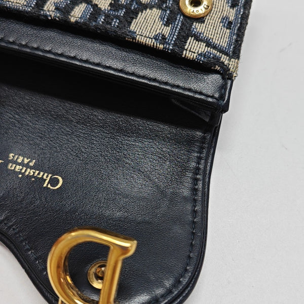 Authenticated pre-owned  Saddle Monogram Fabric Blue Card Holder - Card Holder at Looply