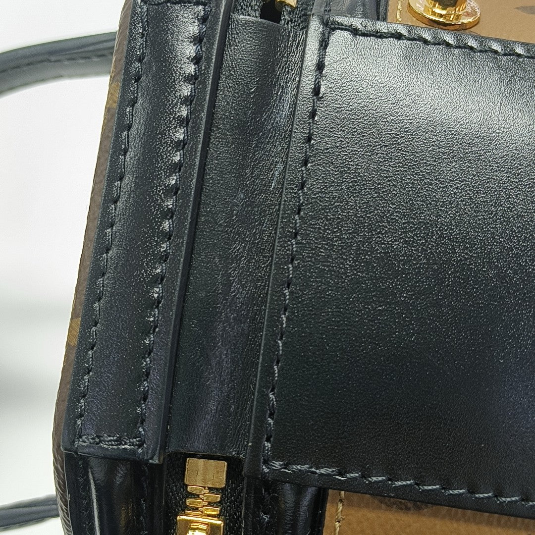 CANNES PM Monogram Coated Canvas Brown