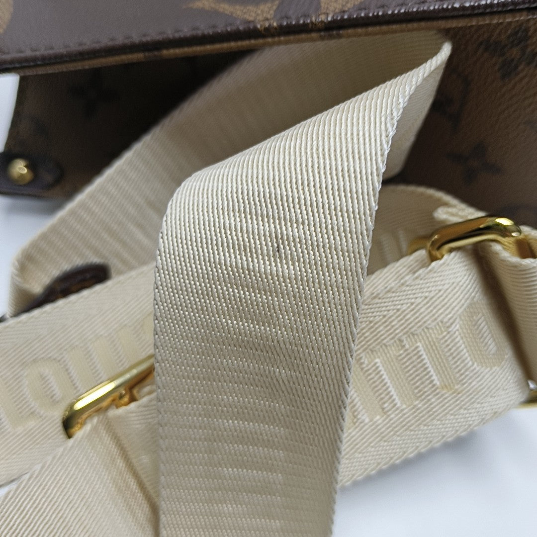 ONTHEGO PM Monogram Coated Canvas Brown