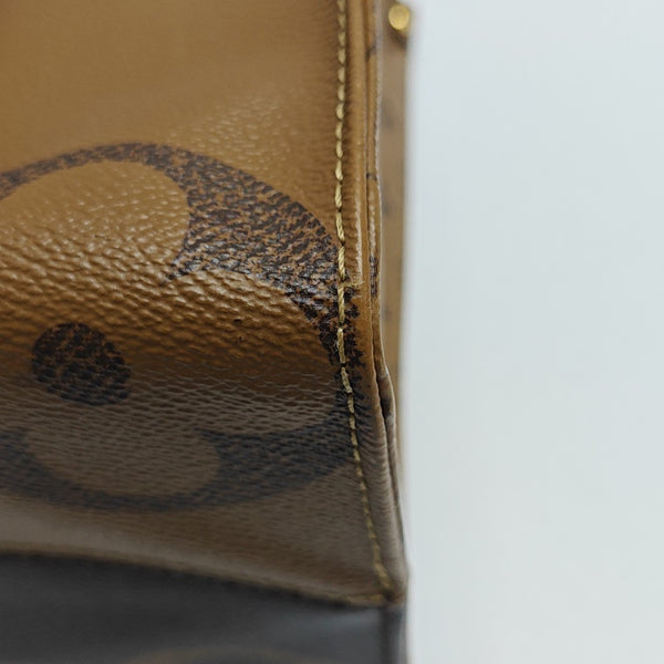 ONTHEGO MM Monogram Coated Canvas Brown