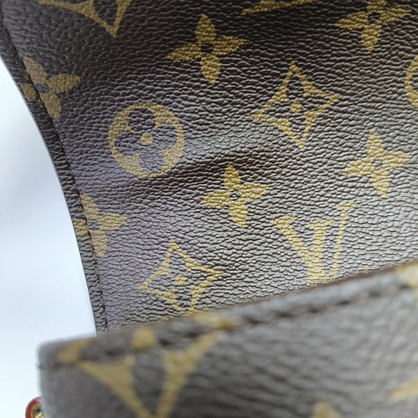 MÉTIS EAST WEST Monogram Coated Canvas Brown