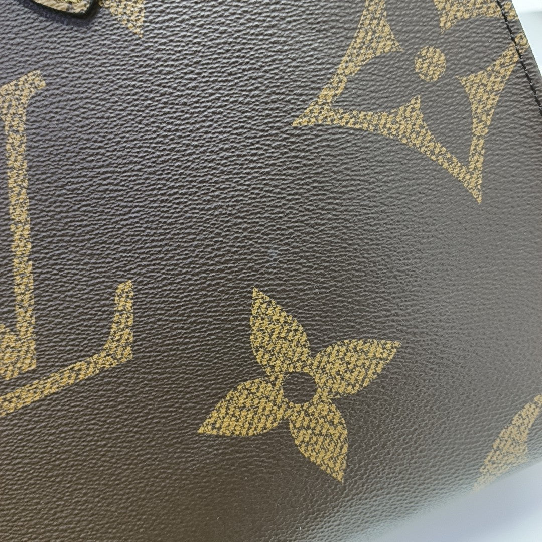 ONTHEGO MM Monogram Coated Canvas Brown